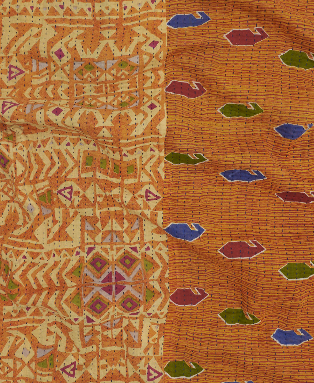 Kantha quilt throw featuring light orange geometric traditional kantha hand stitching