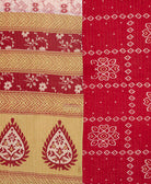 kantha quilt throw with a tag featuring the hand-stitched signature of the maker