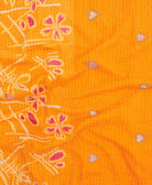 kantha quilt throw with a tag featuring the hand-stitched signature of the maker