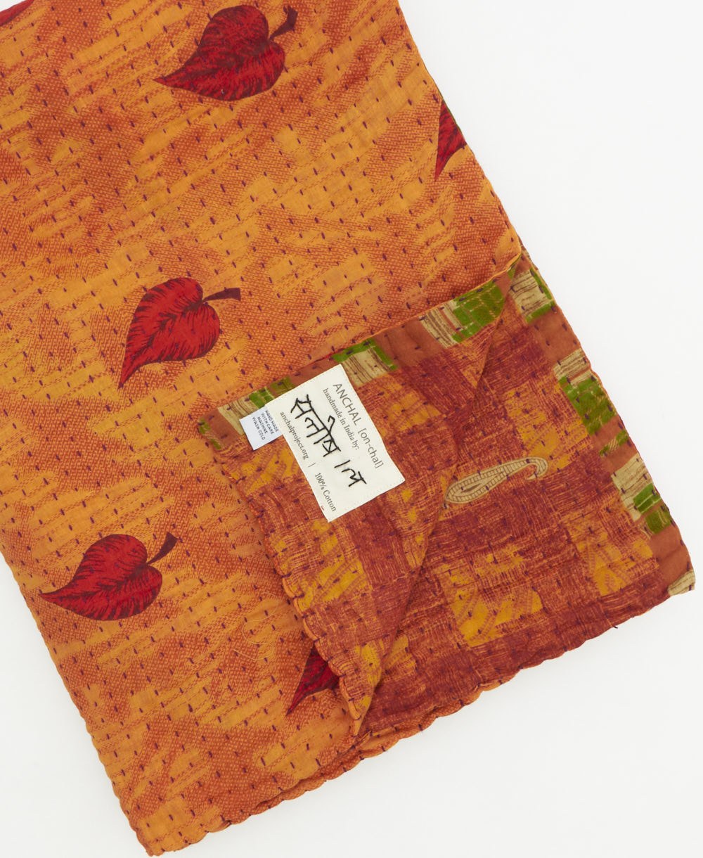 Kantha quilt throw featuring traditional kantha hand stitching