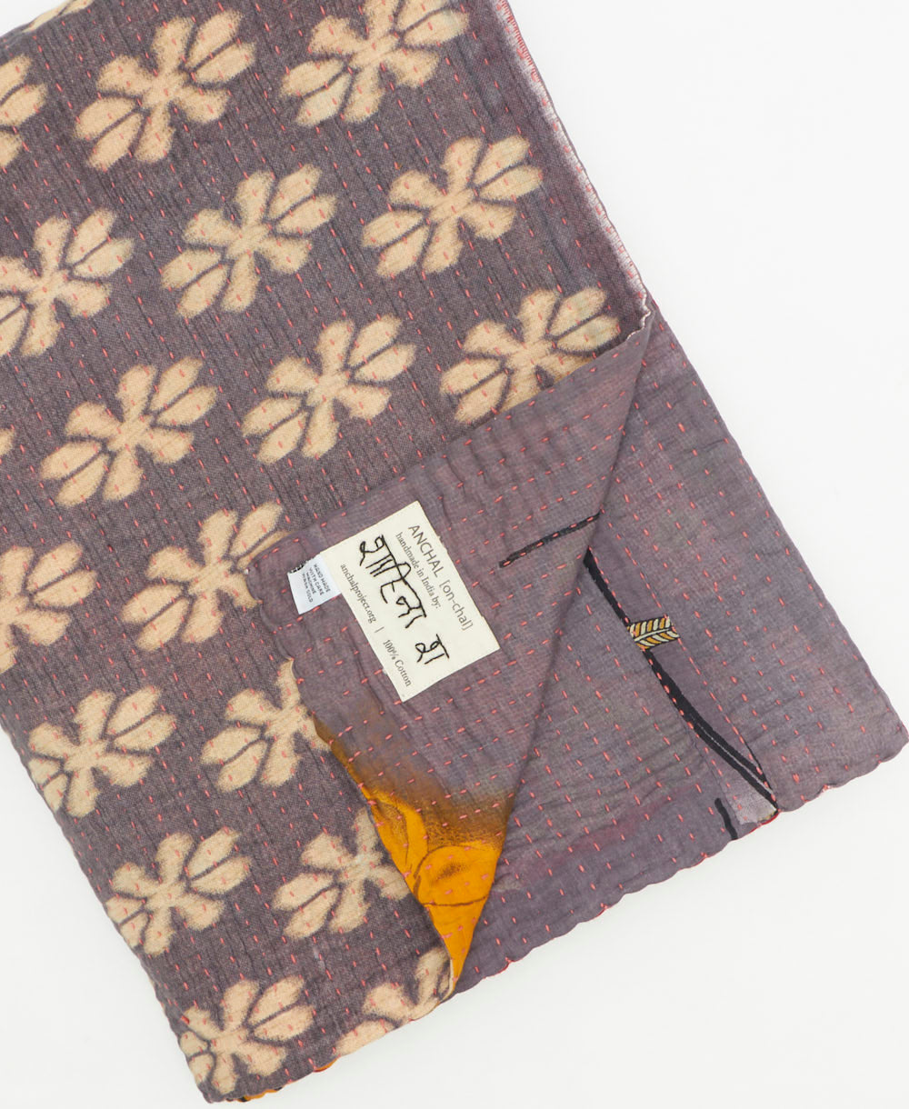 Kantha quilt throw featuring traditional kantha hand stitching