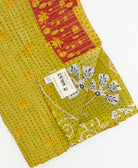 Kantha quilt throw featuring traditional kantha hand stitching