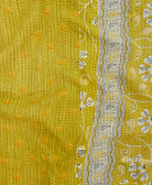 kantha quilt throw with a tag featuring the hand-stitched signature of the maker