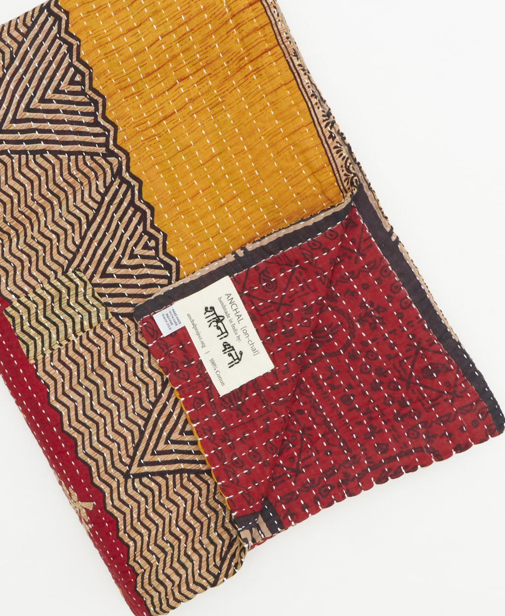 Kantha quilt throw featuring traditional kantha hand stitching