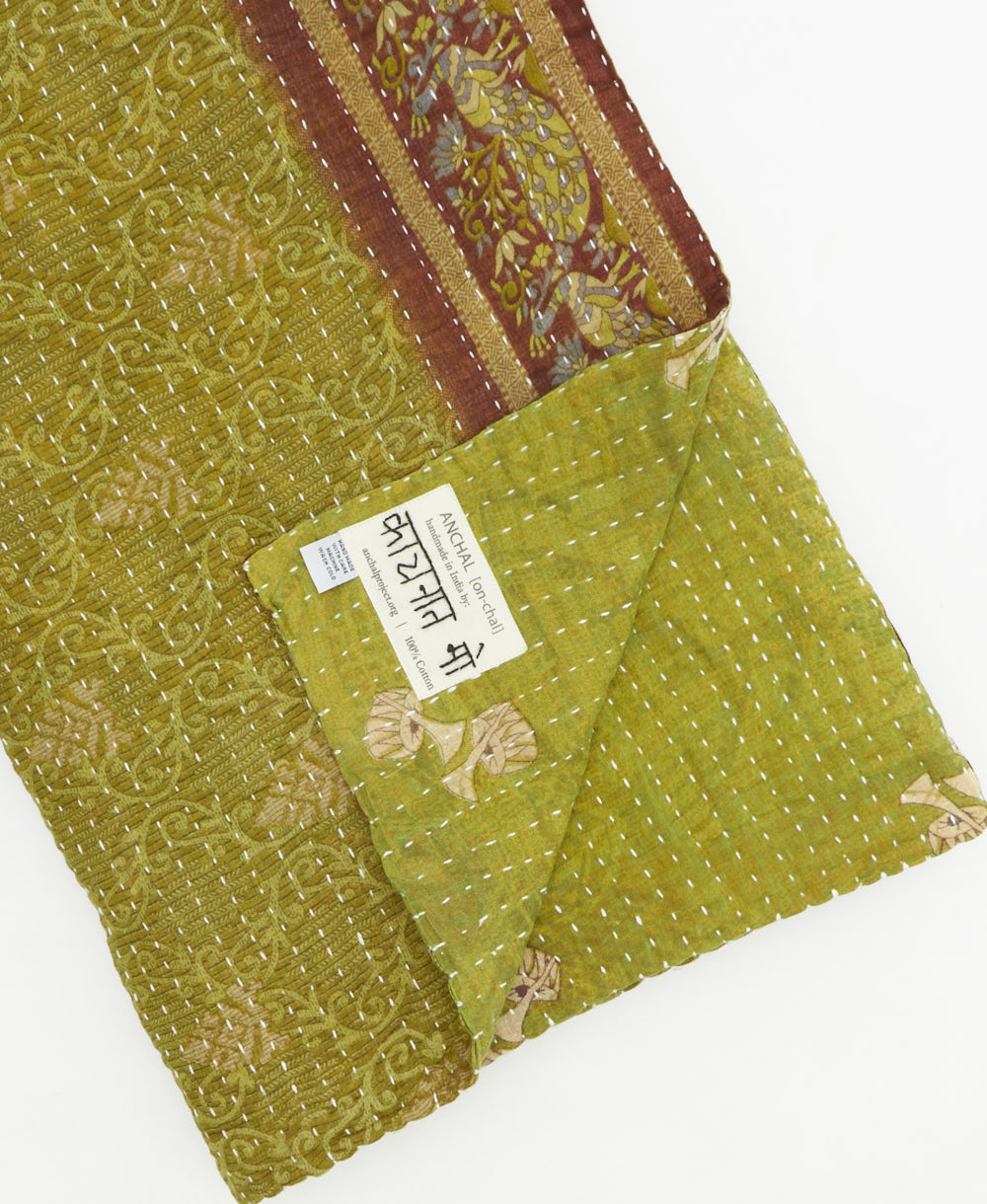 Kantha quilt throw featuring traditional kantha hand stitching