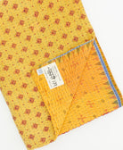 Kantha quilt throw featuring traditional kantha hand stitching