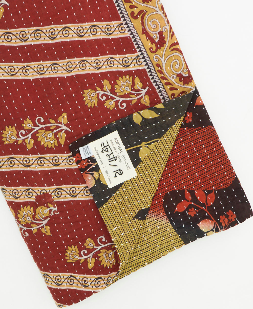 Kantha quilt throw featuring traditional kantha hand stitching