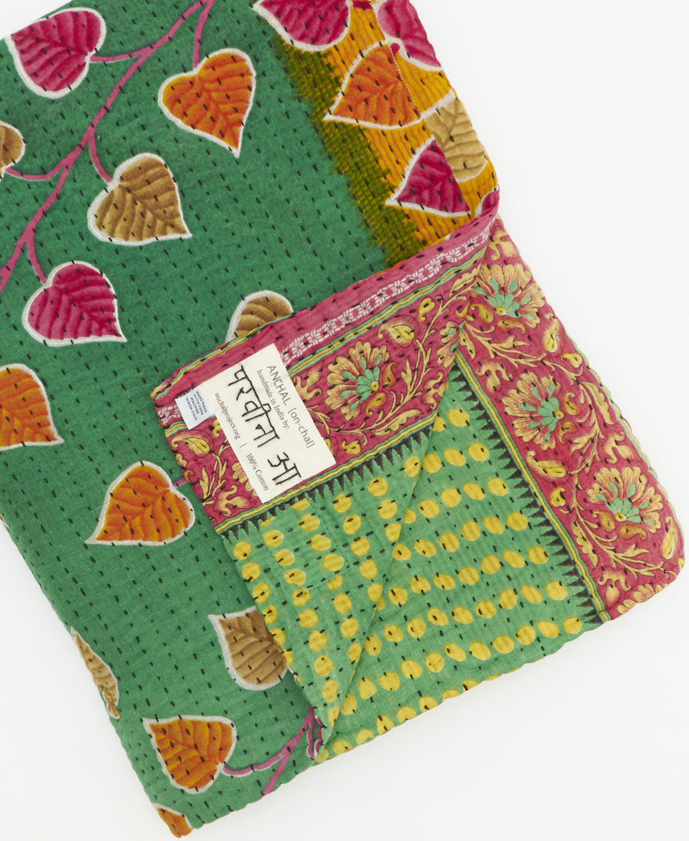 Kantha quilt throw featuring traditional kantha hand stitching