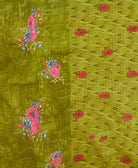 kantha quilt throw with a tag featuring the hand-stitched signature of the maker