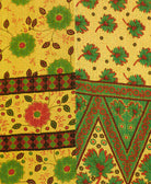 kantha quilt throw with a tag featuring the hand-stitched signature of the maker