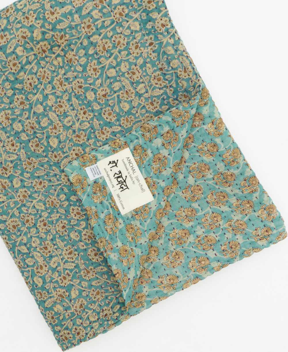 Kantha quilt throw featuring traditional kantha hand stitching