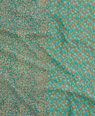 kantha quilt throw with a tag featuring the hand-stitched signature of the maker