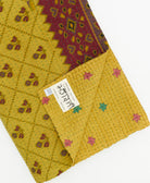 Kantha quilt throw featuring traditional kantha hand stitching