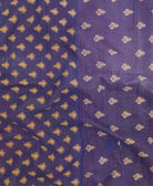 kantha quilt throw with a tag featuring the hand-stitched signature of the maker