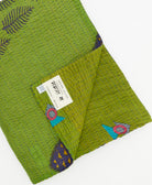 Kantha quilt throw featuring traditional kantha hand stitching