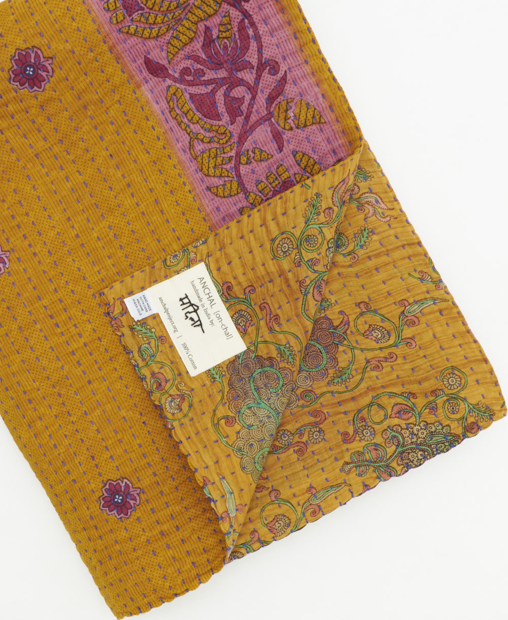 Kantha quilt throw featuring traditional kantha hand stitching
