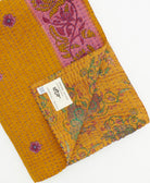 Kantha quilt throw featuring traditional kantha hand stitching