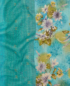 kantha quilt throw with a tag featuring the hand-stitched signature of the maker