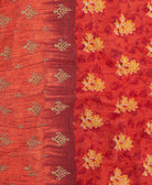 kantha quilt throw with a tag featuring the hand-stitched signature of the maker