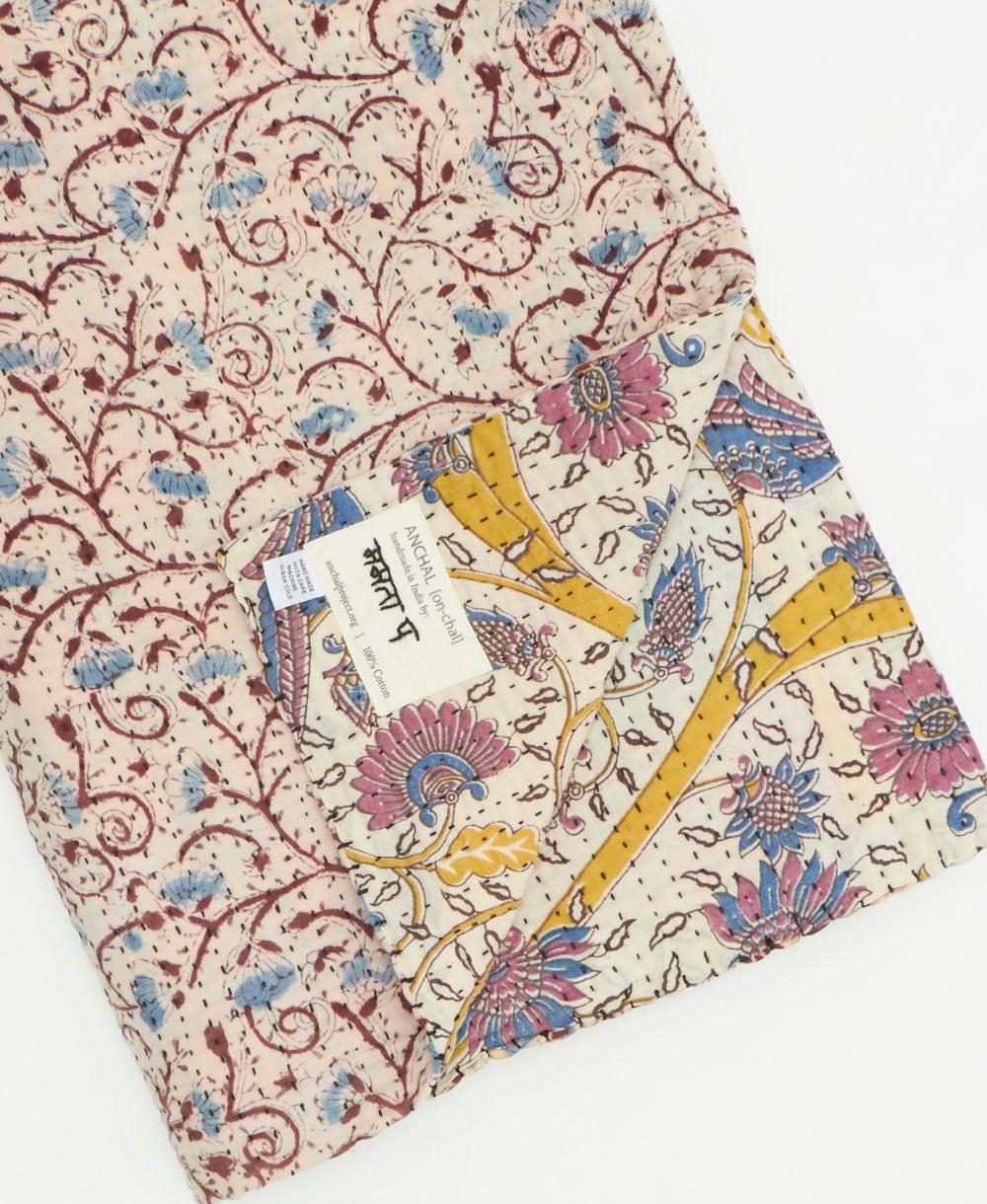 Kantha quilt throw featuring traditional kantha hand stitching