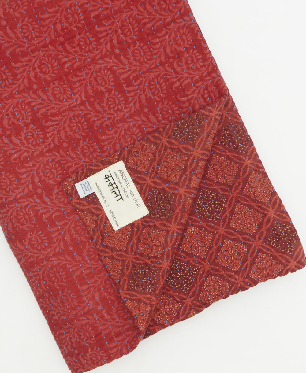 Kantha quilt throw featuring traditional kantha hand stitching