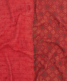 kantha quilt throw with a tag featuring the hand-stitched signature of the maker