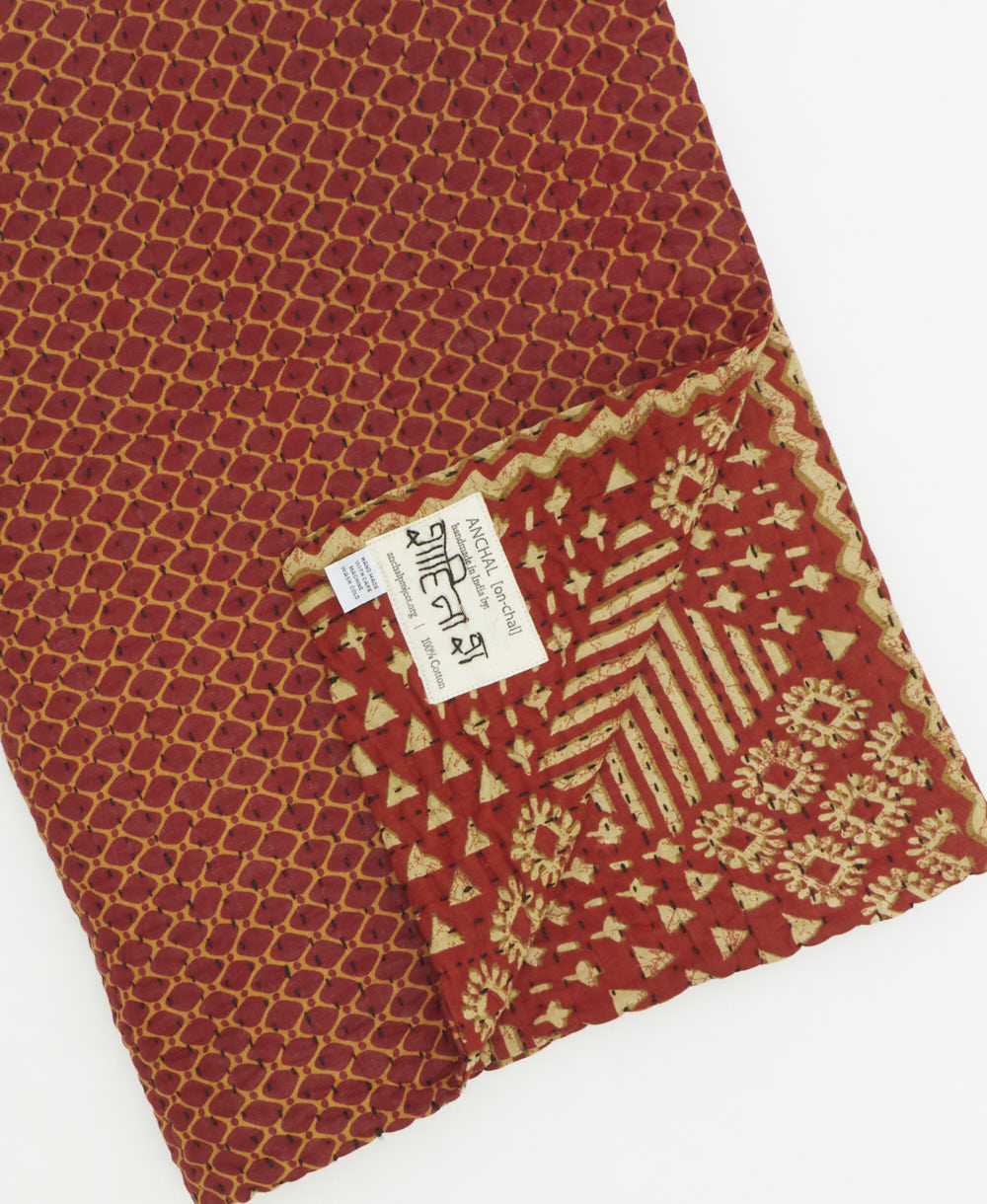 Kantha quilt throw featuring traditional kantha hand stitching