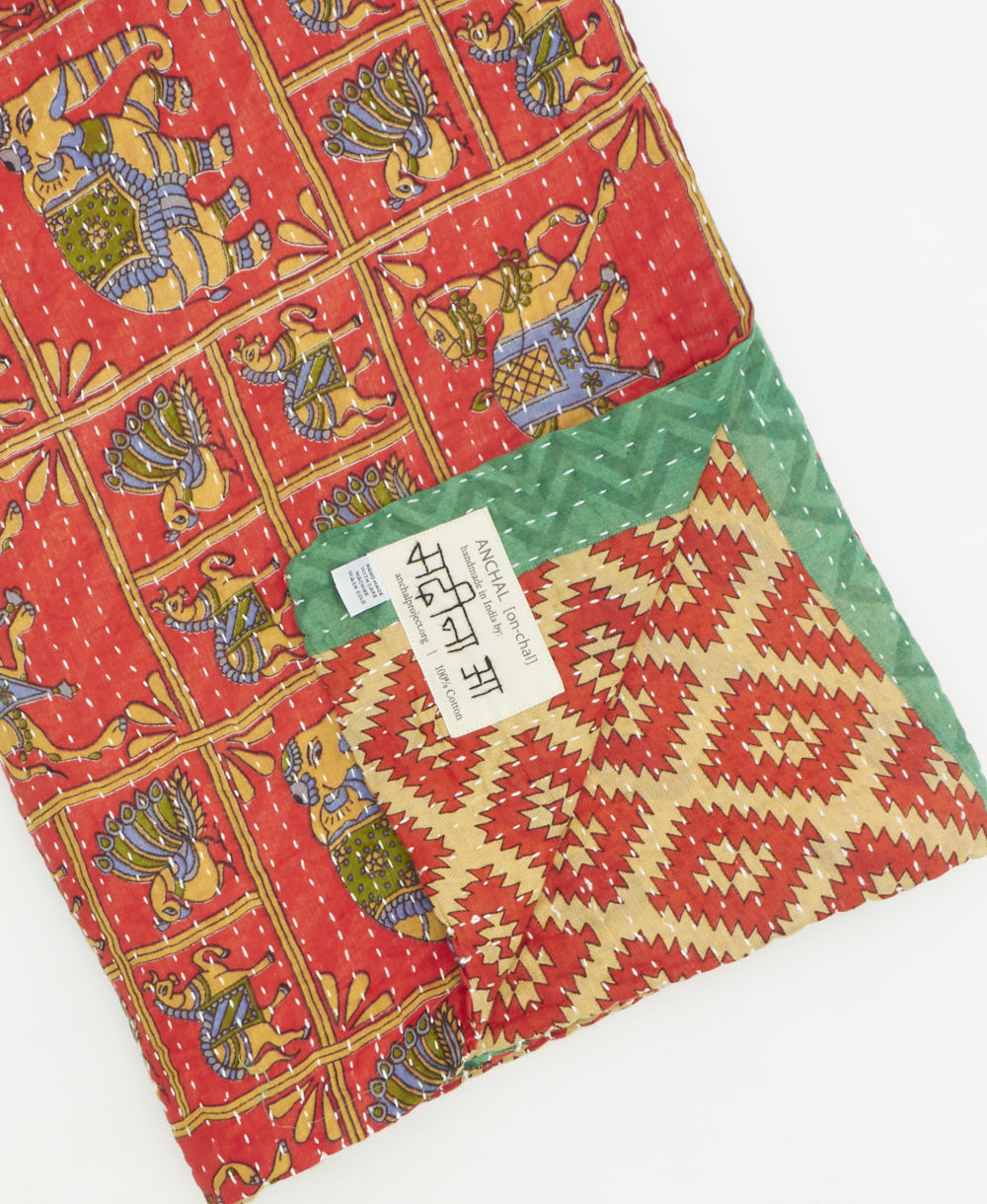 Kantha quilt throw featuring traditional kantha hand stitching
