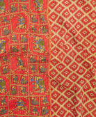 kantha quilt throw with a tag featuring the hand-stitched signature of the maker
