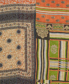 kantha quilt throw with a tag featuring the hand-stitched signature of the maker