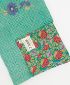 Kantha quilt throw featuring traditional kantha hand stitching