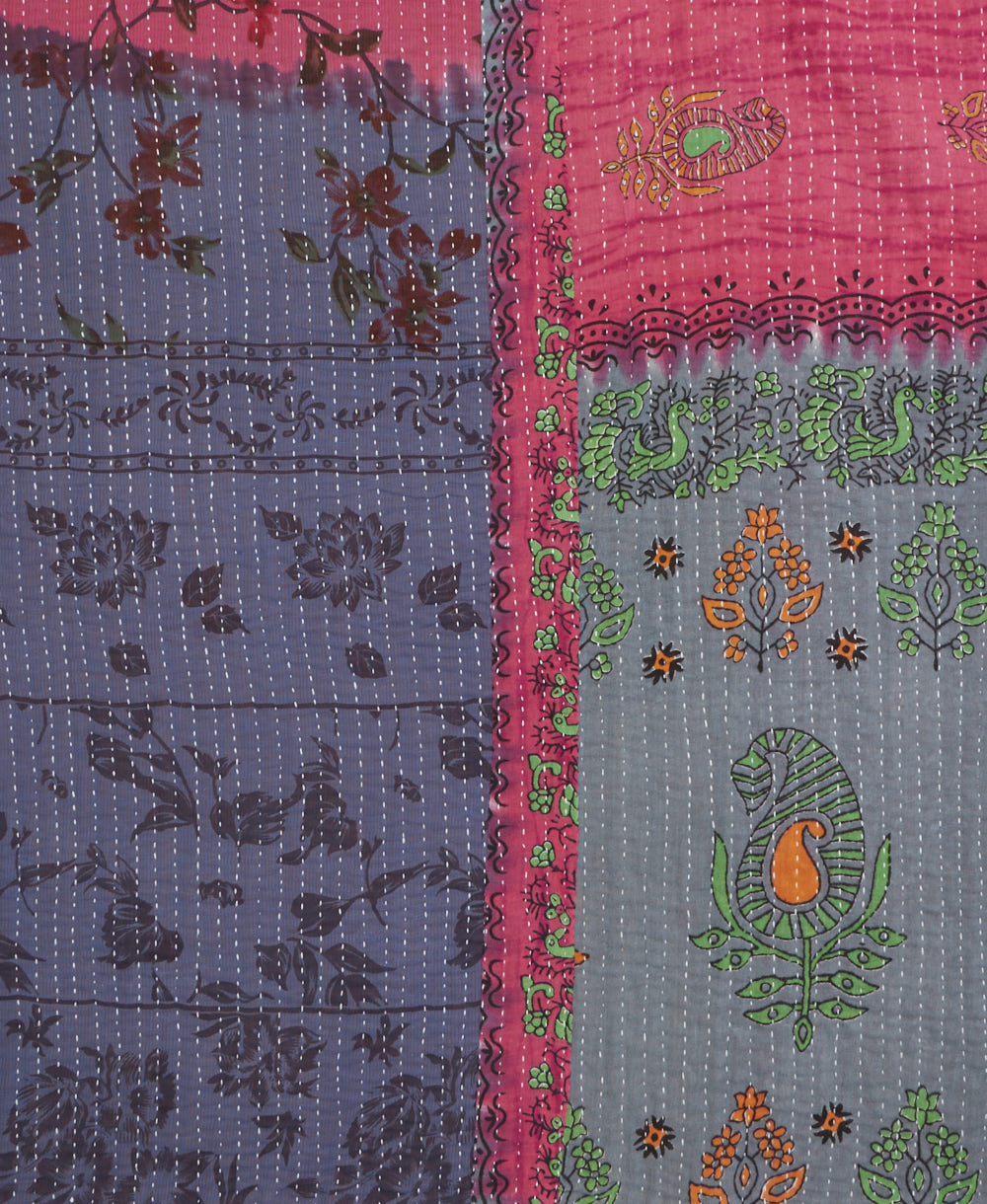 kantha quilt throw with a tag featuring the hand-stitched signature of the maker
