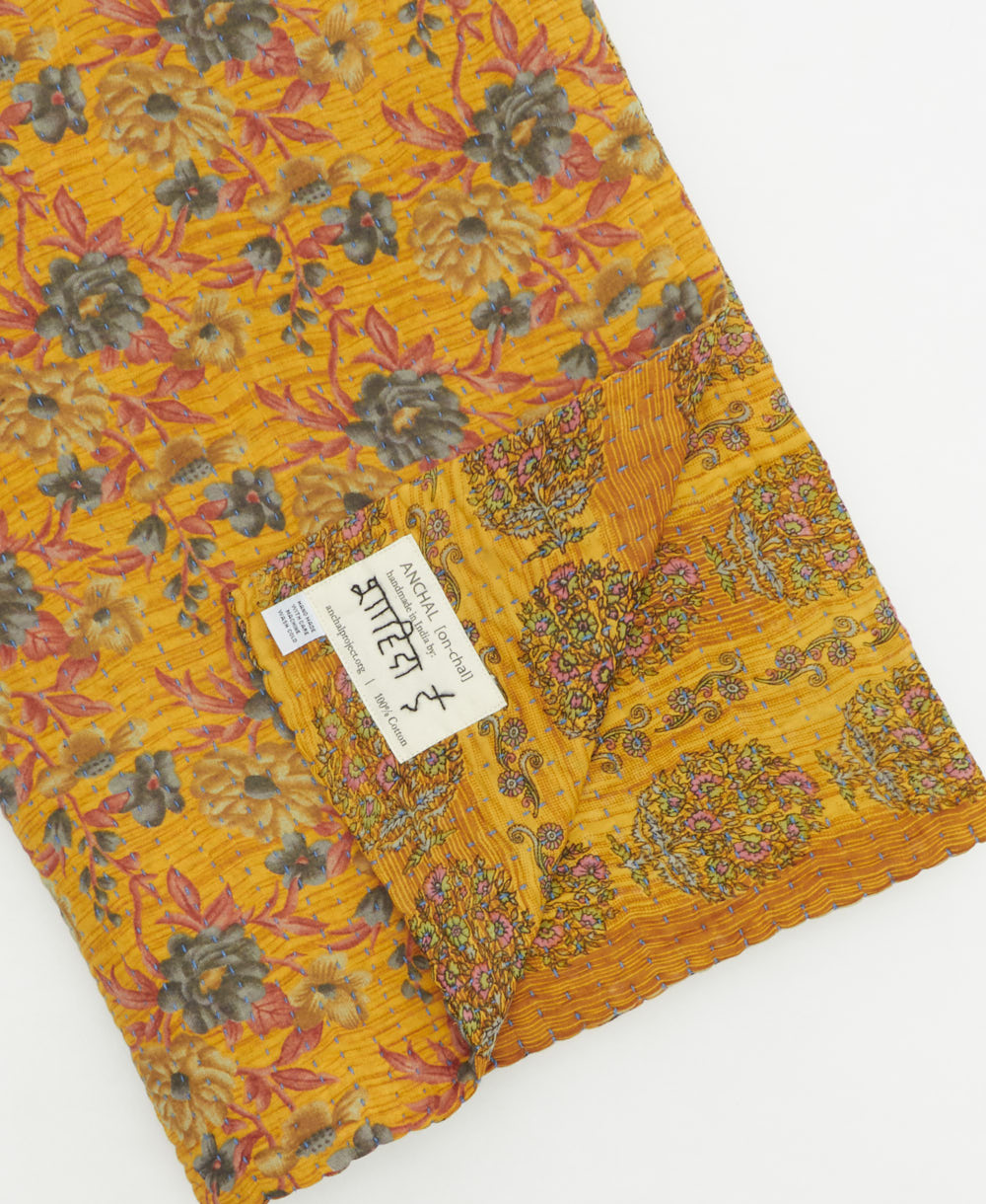 Kantha quilt throw featuring traditional kantha hand stitching