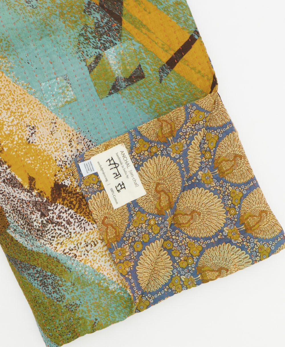 Kantha quilt throw featuring traditional kantha hand stitching