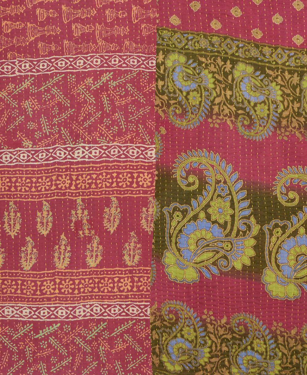 kantha quilt throw with a tag featuring the hand-stitched signature of the maker