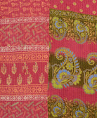kantha quilt throw with a tag featuring the hand-stitched signature of the maker