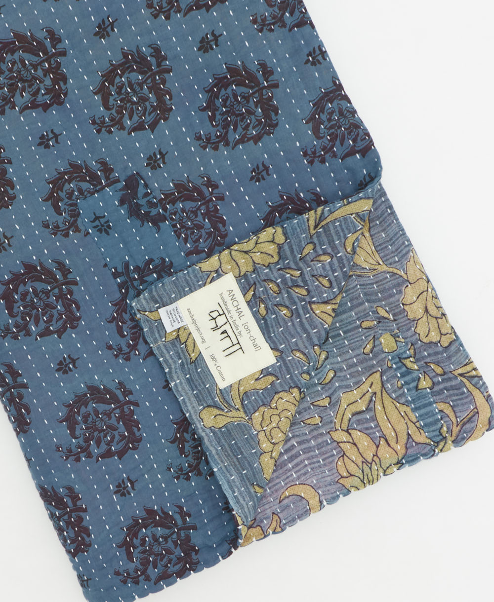 Kantha quilt throw featuring traditional kantha hand stitching