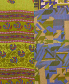 kantha quilt throw with a tag featuring the hand-stitched signature of the maker
