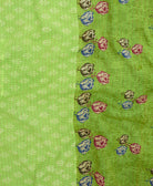 kantha quilt throw with a tag featuring the hand-stitched signature of the maker