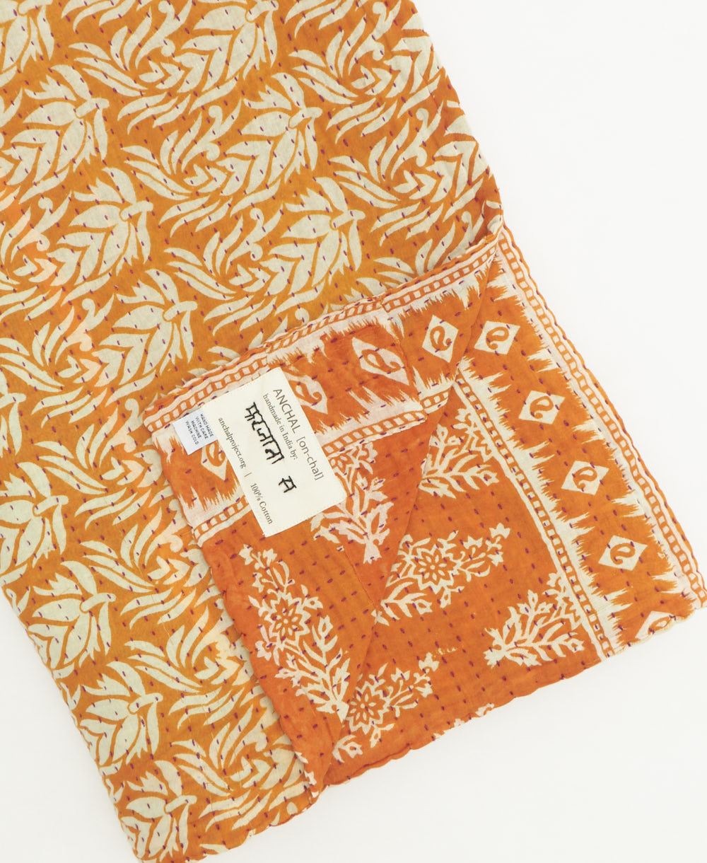 kantha quilt throw featuring traditional kantha hand stitching
