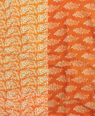 kantha quilt throw with a tag featuring the hand-stitched signature of the maker