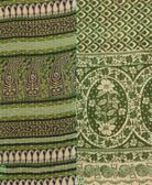kantha quilt throw with a tag featuring the hand-stitched signature of the maker