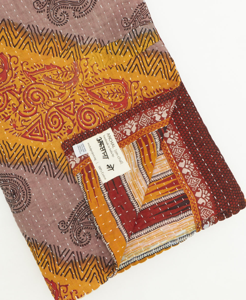 kantha quilt throw featuring traditional kantha hand stitching