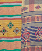 kantha quilt throw with a tag featuring the hand-stitched signature of the maker