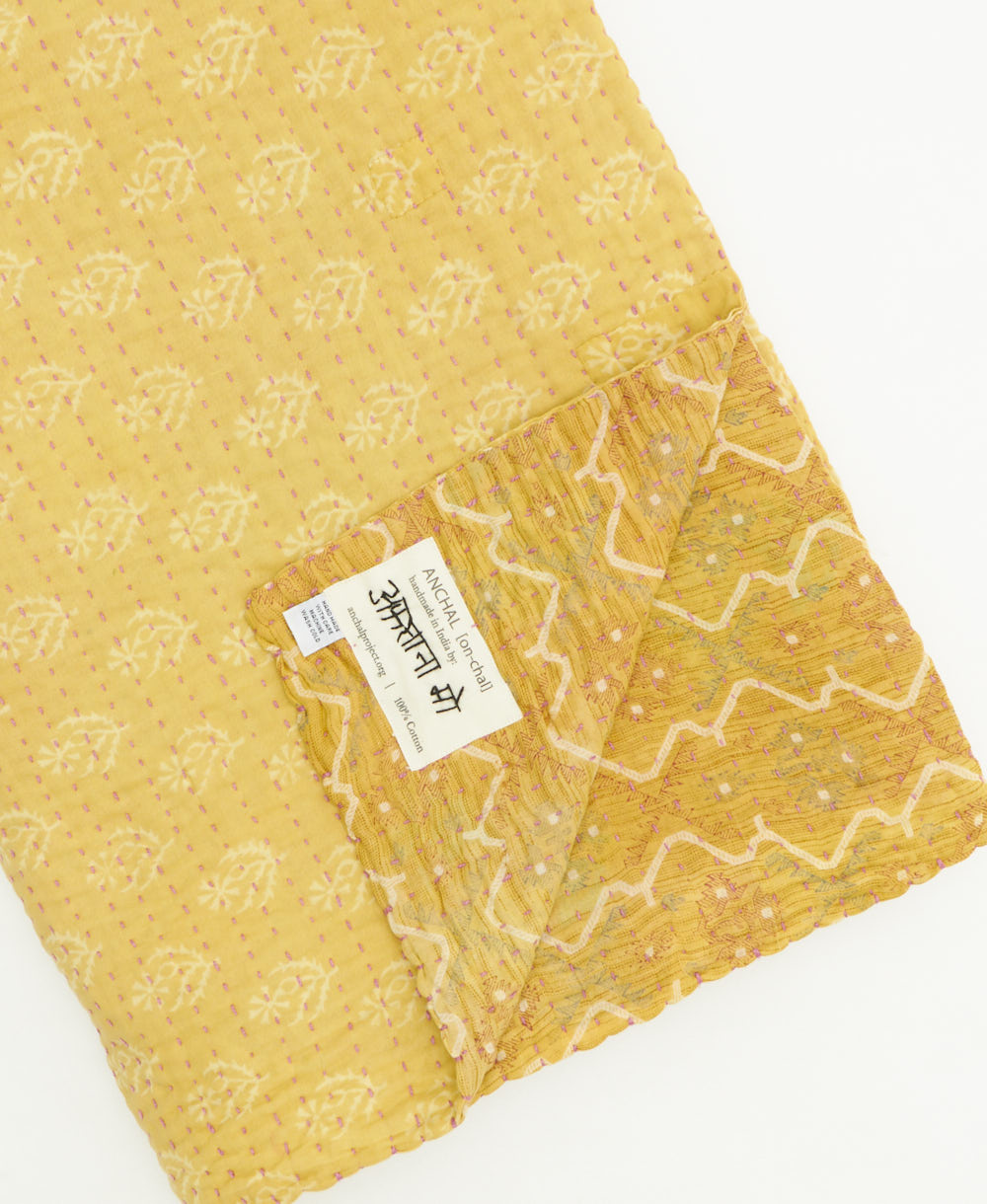 kantha quilt throw featuring traditional kantha hand stitching