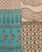 kantha quilt throw with a tag featuring the hand-stitched signature of the maker