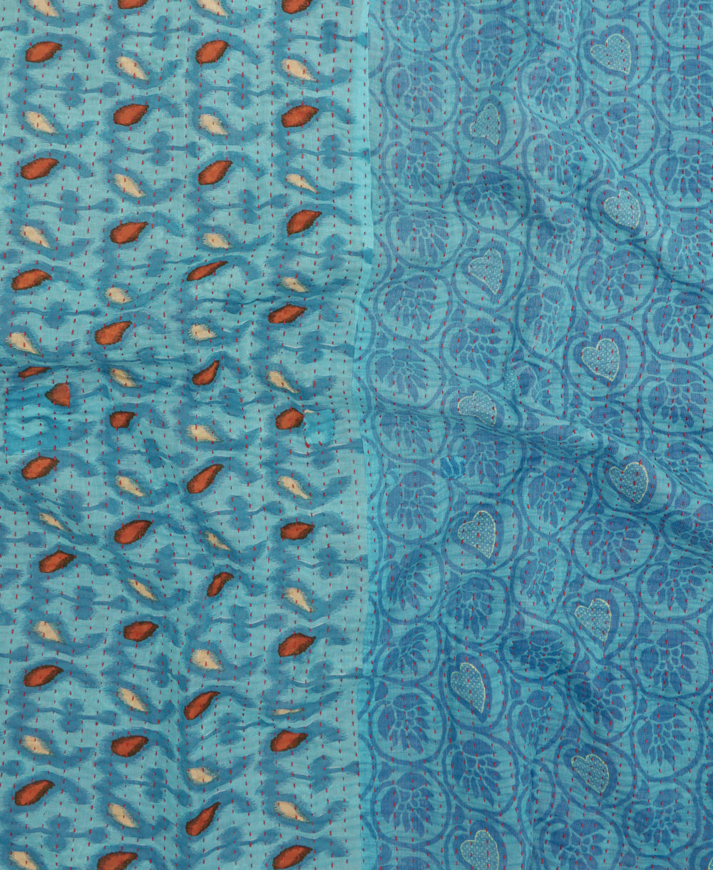 kantha quilt throw with a tag featuring the hand-stitched signature of the maker