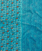 kantha quilt throw with a tag featuring the hand-stitched signature of the maker