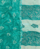 kantha quilt throw with a tag featuring the hand-stitched signature of the maker
