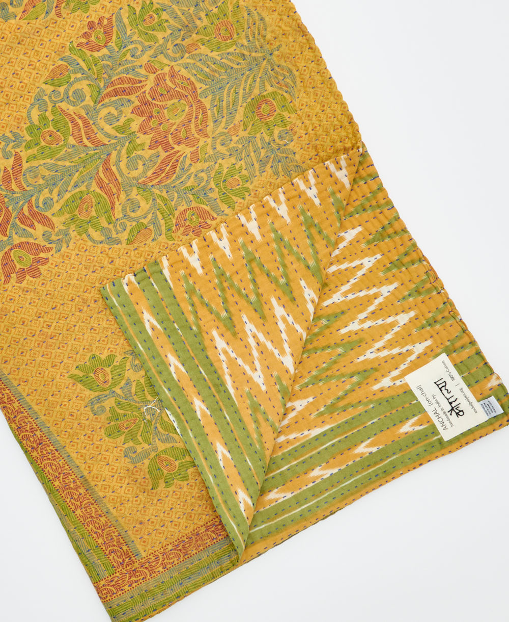 Kantha quilt throw featuring traditional kantha hand stitching